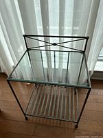 Front view of metal and glass side table