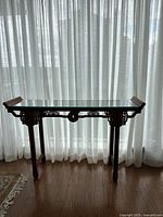 Front view of full console table against curtain