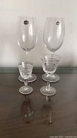 Two Bohemia wine glasses and two smaller sherry/port glasses