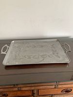 Top view of rectangular metal serving tray on table
