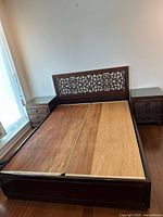 Full view of assembled queen platform bed with both nightstands