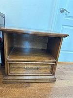 Front view showing open shelf and single drawer