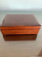 Closed solid wood jewellery box top view