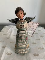 Front view showing “Dear Mom” text, dress graphics and wings