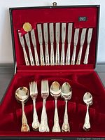 Open case showing all 18 pieces of flatware