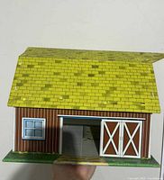 Front view showing sliding barn doors and window