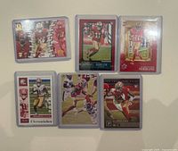 Overall view of the six Brandon Aiyuk rookie football cards in protective sleeves