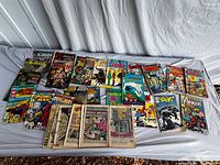 Full lot of comic books laid out on table