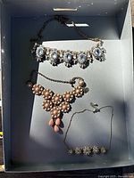 Overview of three costume jewellery pieces