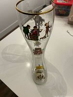 Front view of glass boot with decals and gold rim