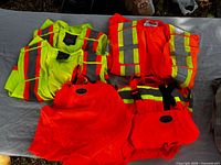 All six hi-vis apparel pieces laid out on table