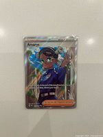 Front view of holographic Amarys Supporter Trainer card in sleeve