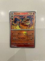 Front of Flareon holographic card in sleeve