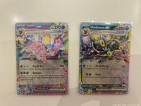 Fronts of Espeon ex and Umbreon ex holographic cards
