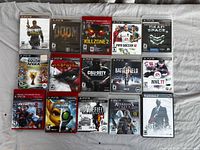 Group shot of all 16 game cases laid out on surface