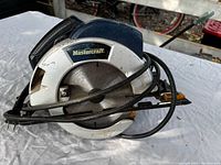 Front view showing Mastercraft logo, blade, cord wrapped around tool