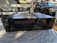 Front view showing Sony branding, model STR-AV920, controls, display and attached power cord