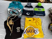 All five sports apparel items displayed