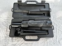 Open carrying case showing spotting scope and tripod