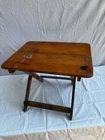 Table fully opened showing top surface and legs