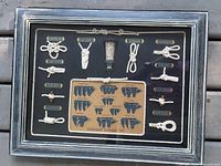 Front view of framed shadowbox showing knots, lantern, sail diagram and frame finish