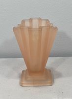 Front view of frosted pink Grantham vase showing ribbed fan shape and square base