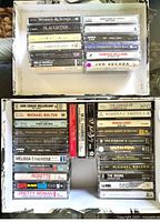 Overall view of two boxes showing the cassette tapes arranged in three sections