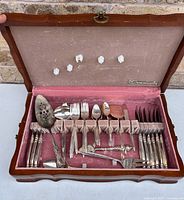 Open flatware chest showing all utensils in place