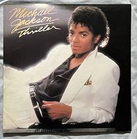 Front cover with Michael Jackson portrait and Thriller title