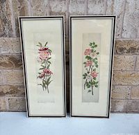 Both framed floral watercolours side by side
