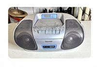 Front view showing entire Panasonic RX-D27 unit with speakers, cassette deck, controls