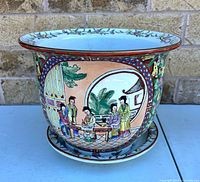 Planter with saucer, front view showing full design