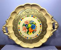 Full view of cream and gold scalloped wooden tray with handles