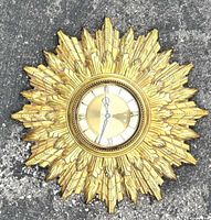 Front view showing full sunburst design and overall condition