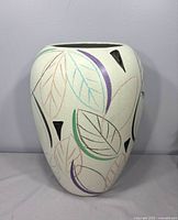 Front view of Scheurich ceramic vase showing leaf motifs