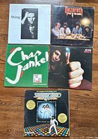 Front covers of all five albums