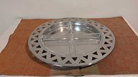 Full view of stainless steel tray with lattice rim and glass inserts