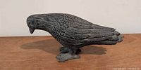 Left side view of resin crow sculpture
