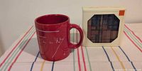 Mug beside boxed coasters showing overall lot
