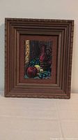 Full view of framed still life painting