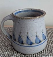 Front view of signed Wright Pottery stoneware pitcher