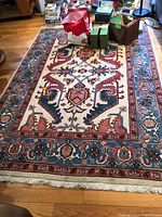 Full view of largest rug on floor with pattern visible