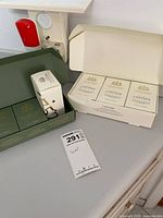 Both gift boxes open showing soap bars and single extra bar