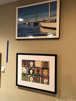 Context view of framed portrait artwork (bottom) on wall