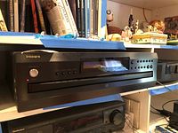 Front view of Integra CDC-3.4 CD changer on shelf