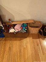 Both baskets side by side, rectangular basket filled with plush toys