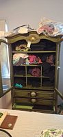 Wardrobe with multiple folded garments in cubbies and drawers