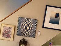 All three framed prints on wall