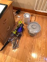 Ryobi and Dyson vacuums, air purifier, salad spinner on floor