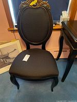 Front view of accent chair showing upholstery and frame